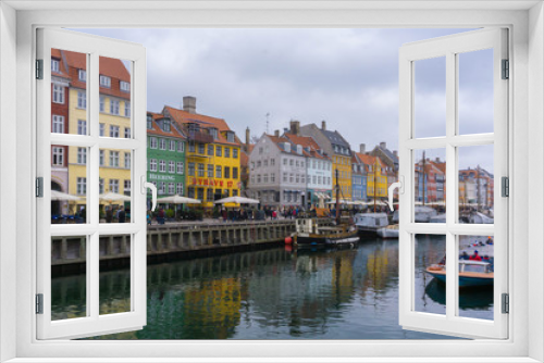 Fototapeta Naklejka Na Ścianę Okno 3D - The colorful row of buildings along the waterfront at the Nyhavn district in Copenhagen