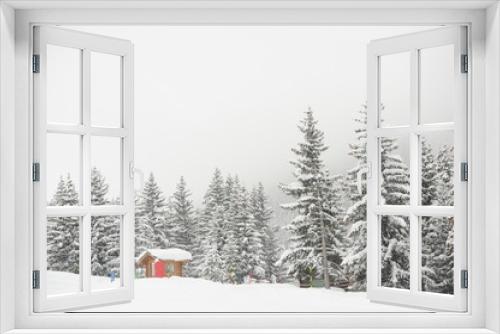 Fototapeta Naklejka Na Ścianę Okno 3D - Winter scenery with hut and forest with snowy background 