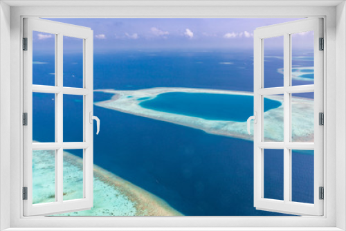 Fototapeta Naklejka Na Ścianę Okno 3D - Aerial view of Maldives atolls is the world top beauty. Maldives tourism. Exotic aerial landscape in Maldives islands