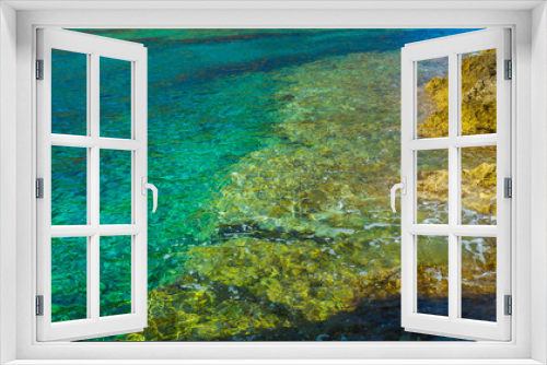 Fototapeta Naklejka Na Ścianę Okno 3D - Crystal clear turquoise water and rocky seaside
