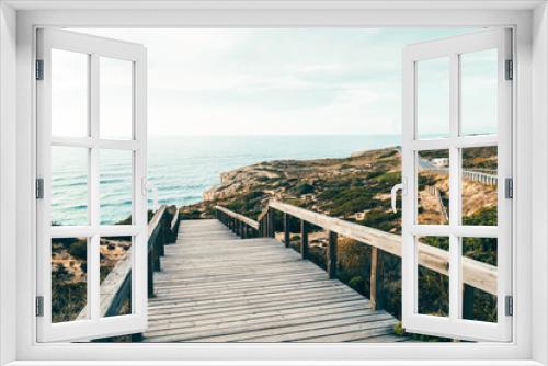 Fototapeta Naklejka Na Ścianę Okno 3D - Wooden Stair Leading To Beautiful Beach With Turquoise Water In Algarve, Portugal