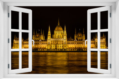 View on the The Hungarian Parliament Building, beside the Danube River. European travel.  Night scene.  Budapest. Hungarian landmarks.
