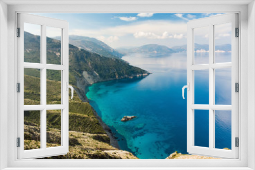 Fototapeta Naklejka Na Ścianę Okno 3D - Scenic aerial view of picturesque jagged coastline of Kefalonia with clear turquoise waters, surrounded by steep cliffs.