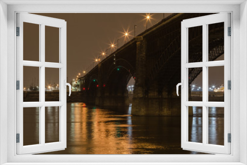 Fototapeta Naklejka Na Ścianę Okno 3D - Classic stone bridge over Mississippi River with calm water at night with lights reflecting