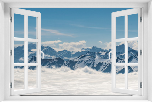 Fototapeta Naklejka Na Ścianę Okno 3D - Switzerland, scenic panoramic view on snow Alps peaks above white clouds