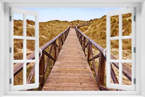 Fototapeta Naklejka Na Ścianę Okno 3D - Wooden walkway with sea, sand dunes, cala mesquida, mallorca, spain.