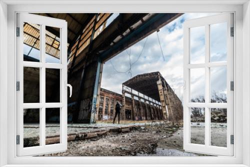 Fototapeta Naklejka Na Ścianę Okno 3D - Old abandoned factory architect on a cloudy day