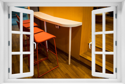 New orange leather seat chairs and wooden counter in the room