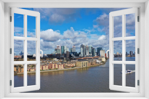 Aerial bird's eye panoramic photo taken by drone of iconic Canary Wharf skyscraper complex and business district, Isle of Dogs, London, United Kingdom