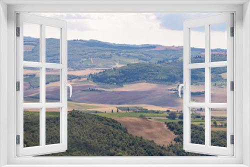 Fototapeta Naklejka Na Ścianę Okno 3D - Val D'Orcia countryside aerial high angle view in Tuscany, Italy with rolling plowed brown hills with farm landscape picturesque meadow fields