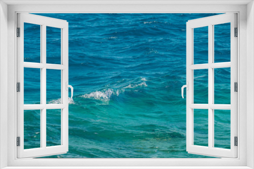 Fototapeta Naklejka Na Ścianę Okno 3D - Wide shot of a beautiful clear turquoise sea ocean water surface with low ripples and subtle waves on seascape background, horizontal picture. Vacation travel background with copyspace for your text