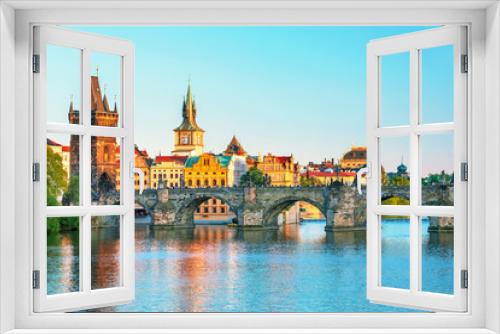 Fototapeta Naklejka Na Ścianę Okno 3D - Scenic view on Vltava rive, Charles bridge and historical center of Prague, buildings and landmarks of old town at sunset, Prague, Czech Republic