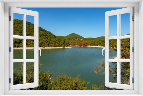 Fototapeta Naklejka Na Ścianę Okno 3D - Emerald water of a lake in Sukko, against the background of a mountain covered with forests. Natural beauty of the resort near Anapa. Nature concept for design
