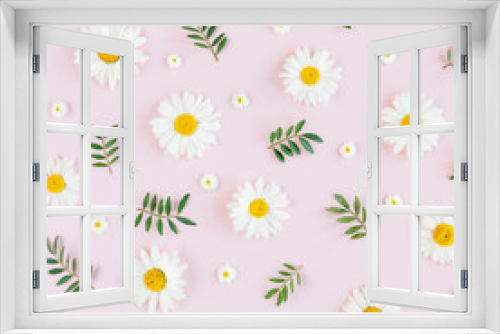 Fototapeta Naklejka Na Ścianę Okno 3D - Pattern made of chamomiles, petals, leaves on pink background. Flat lay, top view 