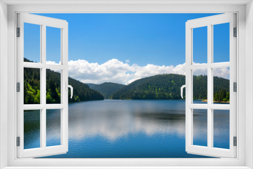 Fototapeta Naklejka Na Ścianę Okno 3D - Beautiful mountain landscape with lake and reflections in water in summer. Tiny house or hotel on side of river. Concept of traveling. Clean environment. 