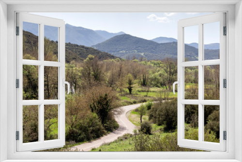 Fototapeta Naklejka Na Ścianę Okno 3D - View of the mountains and narrow road in spring (mountain Achaea, Peloponnese, Greece)
