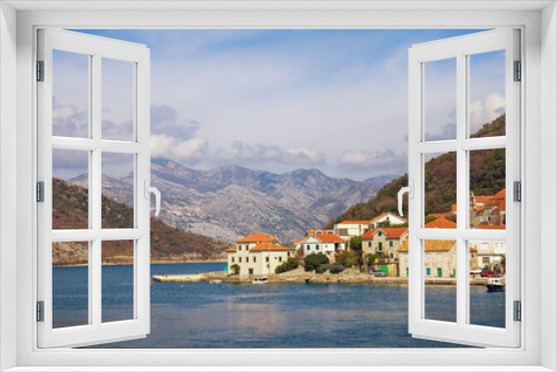 Fototapeta Naklejka Na Ścianę Okno 3D - Beautiful Mediterranean landscape. Small seaside village at the foot of the mountains. Montenegro, Adriatic Sea, Bay of Kotor, Lepetane village