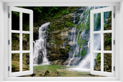 Fototapeta Naklejka Na Ścianę Okno 3D - waterfall in the forest on the island of Mindoro, the Philippines