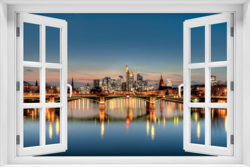 Fototapeta Naklejka Na Ścianę Okno 3D - Die Skyline von Frankfurt am Main am Abend