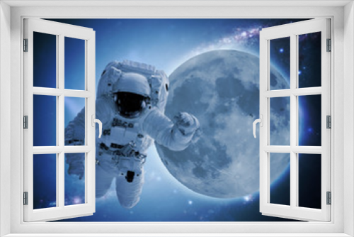 Fototapeta Naklejka Na Ścianę Okno 3D - astronaut levitate in space in front of moon. elements of this images furnished by nasa