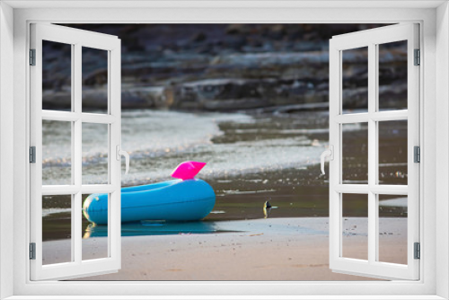 Fototapeta Naklejka Na Ścianę Okno 3D - Blue Inflatable ring on the beach Background sea.