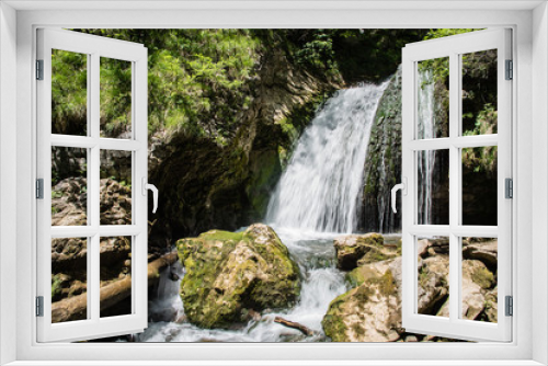 Fototapeta Naklejka Na Ścianę Okno 3D - Wasserfall und Felsen im Sonnenlicht