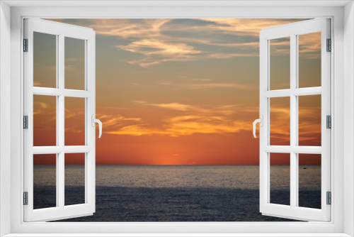 Fototapeta Naklejka Na Ścianę Okno 3D - Puesta de sol en el mar