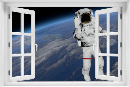 Fototapeta Naklejka Na Ścianę Okno 3D - Astronaut Spacewalk, Astronaut shows thumbs up in the open space.Elements of this image furnished by NASA. 3D rendering
