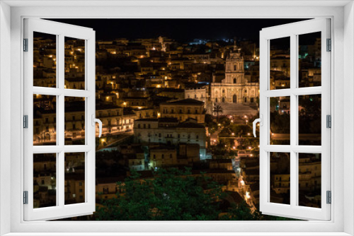 Fototapeta Naklejka Na Ścianę Okno 3D - Night view over the village of Modica in the south of Sicily, Italy