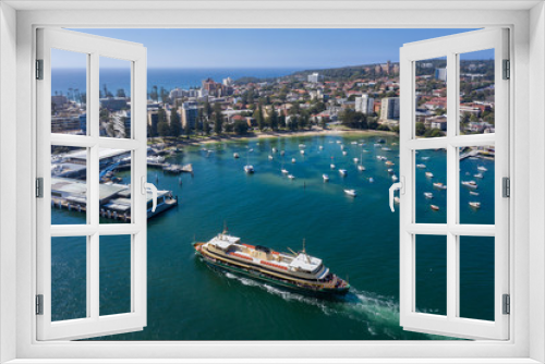 Fototapeta Naklejka Na Ścianę Okno 3D - Aerial view of the Circular Quay ferry approaching Manly Wharf and harbour in Sydney, Australia