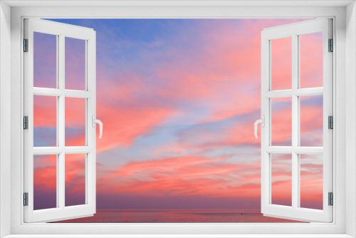 Fototapeta Naklejka Na Ścianę Okno 3D - View of the blue-pink sky with clouds at sunset in the background of the sea. Beautiful natural layout
