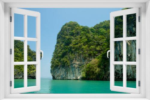 Fototapeta Naklejka Na Ścianę Okno 3D - Beautiful view of the islands and ocean. Green sheer cliffs cover tropic plants. Archipelago in Andaman Sea, Thailand.