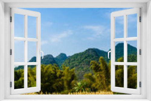 Fototapeta Naklejka Na Ścianę Okno 3D - Countryside and mountain scenery with blue sky background 