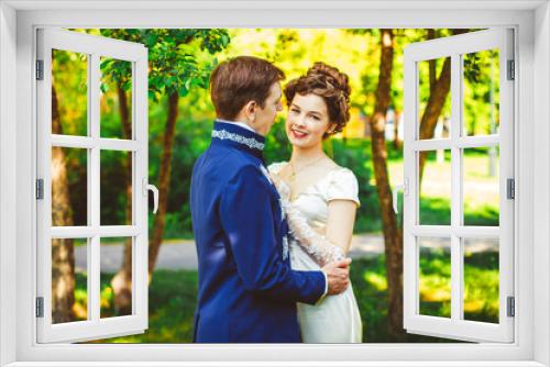 Beautiful couple in evening dress on the nature