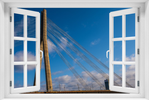 Fototapeta Naklejka Na Ścianę Okno 3D - Riga,Latvia-April 12 2019: Vansu bridge in Riga,Latvia with blue sky