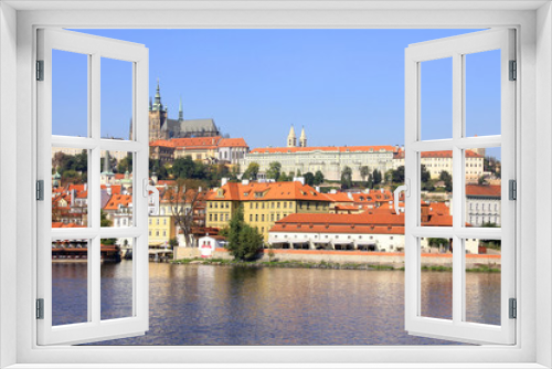 Fototapeta Naklejka Na Ścianę Okno 3D - The View on the autumn Prague gothic Castle above River Vltava