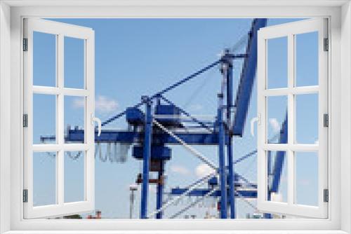 Fototapeta Naklejka Na Ścianę Okno 3D - Blue Port Cranes