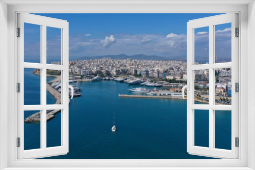 Fototapeta Naklejka Na Ścianę Okno 3D - Aerial drone panoramic photo of iconic port of Marina Zeas or Pasalimani with yachts and sail boats docked and beautiful blue sky - clouds, port of Piraeus, Attica, Greece