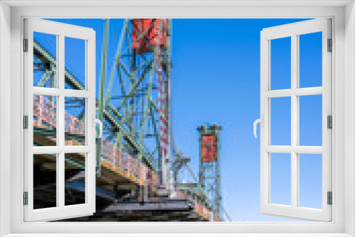 Fototapeta Naklejka Na Ścianę Okno 3D - The transport and pedestrian truss Hawthorne bridge with two towers across the Willamette River in the center of Portland Oregon