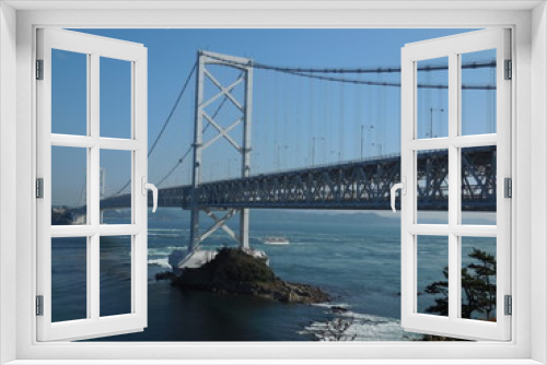 Fototapeta Naklejka Na Ścianę Okno 3D - The gorgeous view of blue sea and the white beautiful bridge