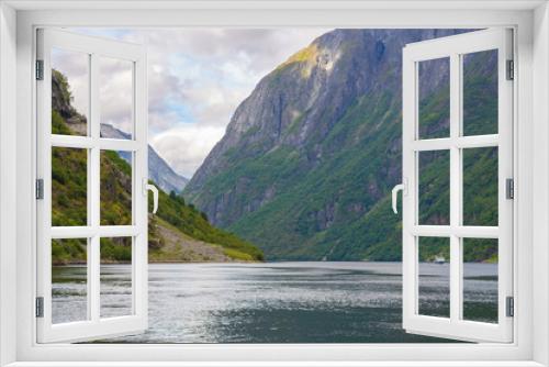 Fototapeta Naklejka Na Ścianę Okno 3D - Panoramic view of Geiranger fjord near Geiranger seaport, Norway. Norway nature and travel background. View from the ferry on the fjord in Norway.