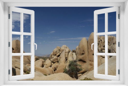 Fototapeta Naklejka Na Ścianę Okno 3D - rocks and blue sky in Joshua Tree National Park California USA