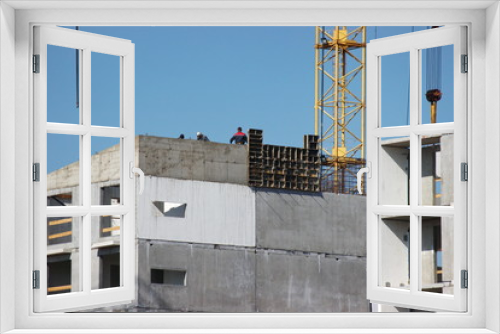 Fototapeta Naklejka Na Ścianę Okno 3D - modern construction of multi-storey and apartment buildings. concrete structures for people's lives in the city. build houses. cranes cargo to height for workers. technical help in hard work.