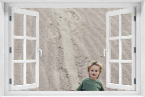 Fototapeta Naklejka Na Ścianę Okno 3D - Child coming down on sand at sand Mountain.