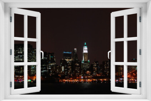 Fototapeta Naklejka Na Ścianę Okno 3D - Panoramic New York City skyline from the Brooklyn at night.