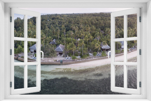 Fototapeta Naklejka Na Ścianę Okno 3D - An idyllic tropical resort is found on a remote island in the Wakatobi National Park, Indonesia. This region is known for its incredible coral reefs and high marine biodiversity.