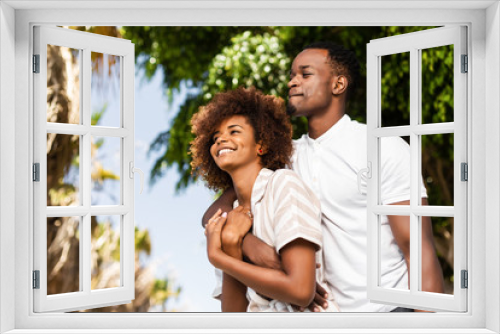 Outdoor protrait of black african american couple embracing each other