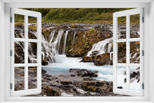 Fototapeta Naklejka Na Ścianę Okno 3D - Scenic view of a wild waterfall with many individual watercourses at a rock stage in the evening light, close up - Location: Iceland, Golden circle, Bruarfoss