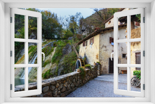 Fototapeta Naklejka Na Ścianę Okno 3D - Ancient watermill wheel, Molinetto della Croda in Lierza valley. Refrontolo. Italy