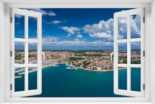 Fototapeta Naklejka Na Ścianę Okno 3D - Aerial view of city of Zadar. Summer time in Dalmatia region of Croatia. Coastline and turquoise water and blue sky with clouds. Photo made by drone from above.